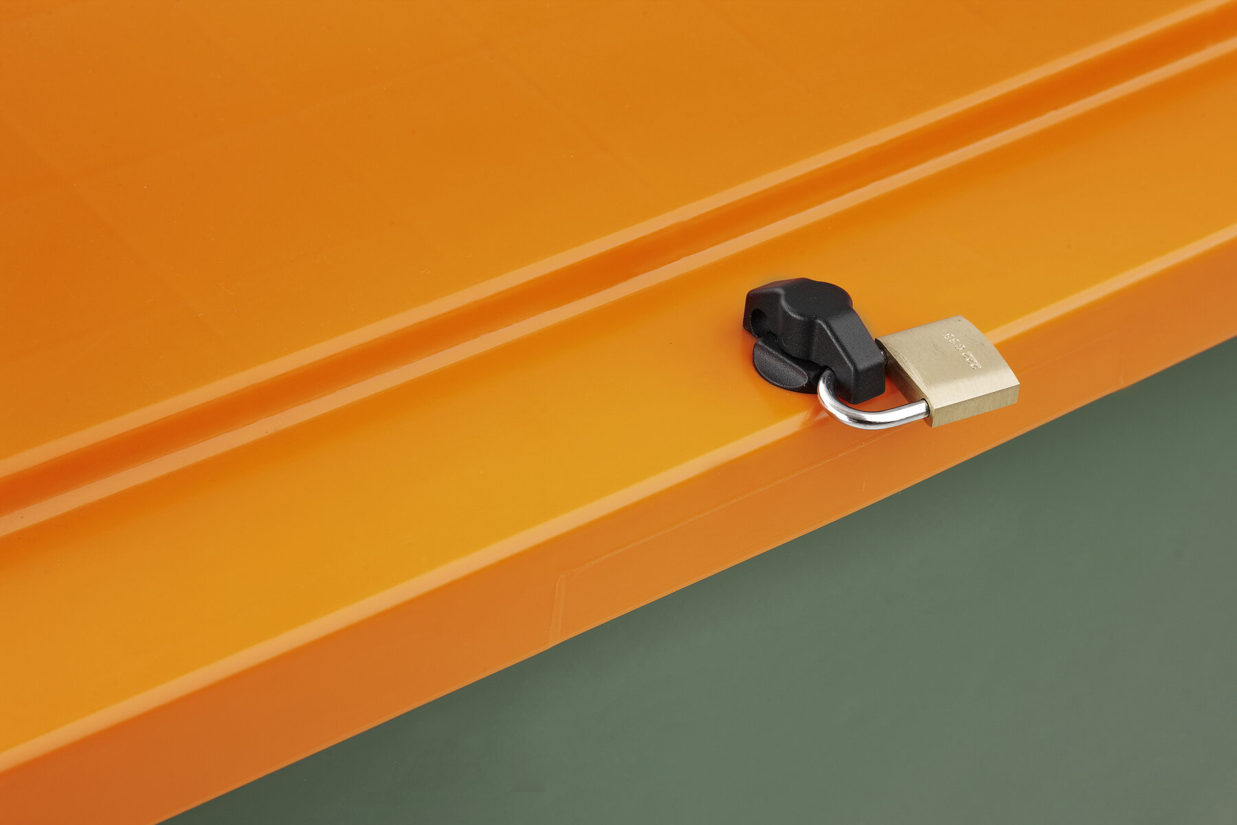 lock on green container with orange lid