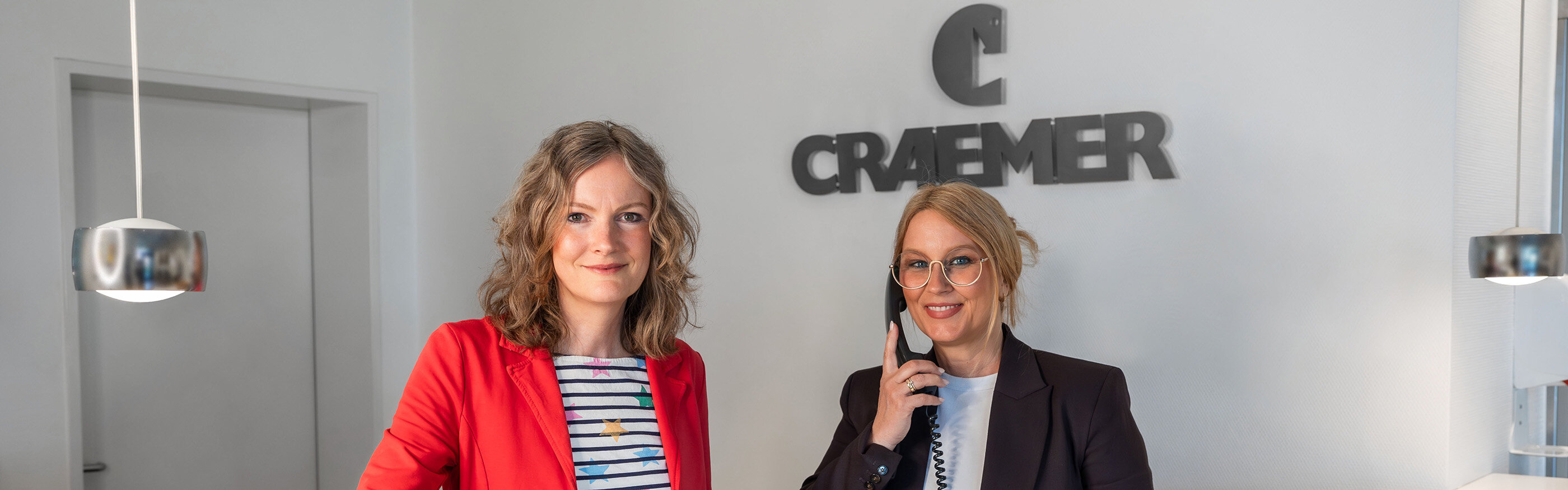 Two friendly women at reception