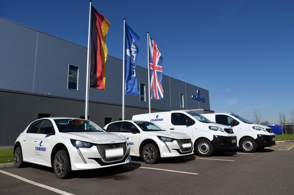 Four Craemer electric cars in front of Craemer UK building