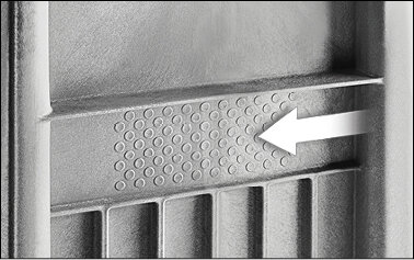 Stippled area marked with arrow